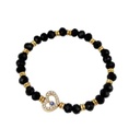 Pulsera Elastica Negra y Dorada con Corazon Dorado con Strass